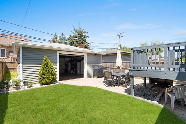 6921 26th St, Berwyn, IL 60402 - view of yard with a patio area, an outbuilding, a detached garage, and a wooden deck