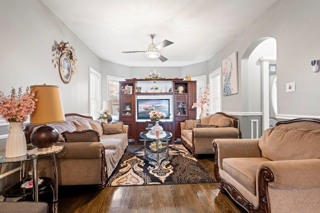 6921 26th St, Berwyn, IL 60402 - living room featuring a ceiling fan, wood finished floors, and arched walkways