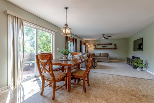 843 Brahms Rd, Volo, IL 60073 - dining space with a chandelier, a ceiling fan, and light carpet