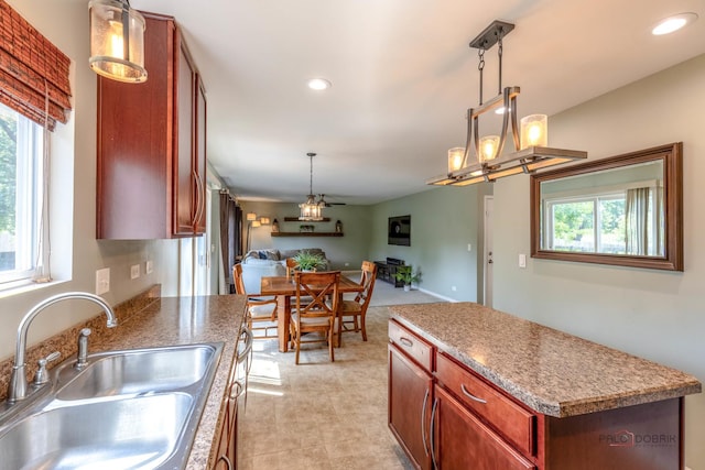 843 Brahms Rd, Volo, IL 60073 - kitchen featuring open floor plan, recessed lighting, decorative light fixtures, a center island, and light tile patterned flooring