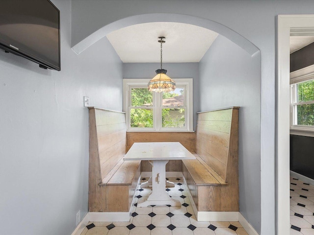 1639 Arlington Ave, Rockford, IL 61107 - dining space featuring breakfast area, arched walkways, and tile patterned floors