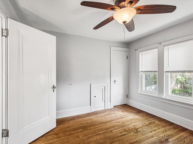 1639 Arlington Ave, Rockford, IL 61107 - unfurnished bedroom with wood finished floors, a closet, and ceiling fan