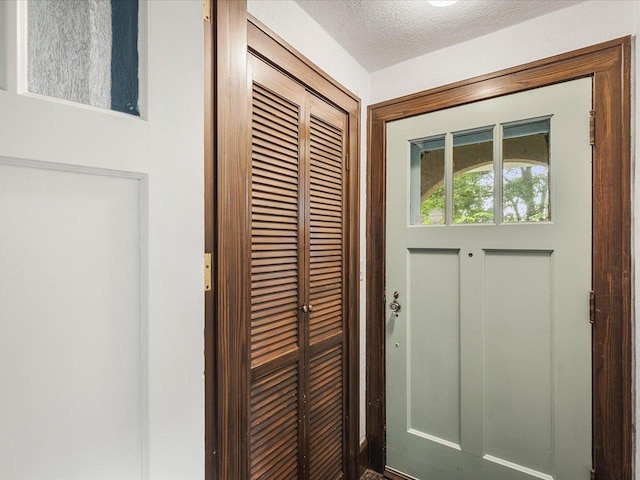1639 Arlington Ave, Rockford, IL 61107 - doorway to outside with a textured ceiling