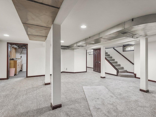1639 Arlington Ave, Rockford, IL 61107 - below grade area featuring light carpet, stairway, and recessed lighting
