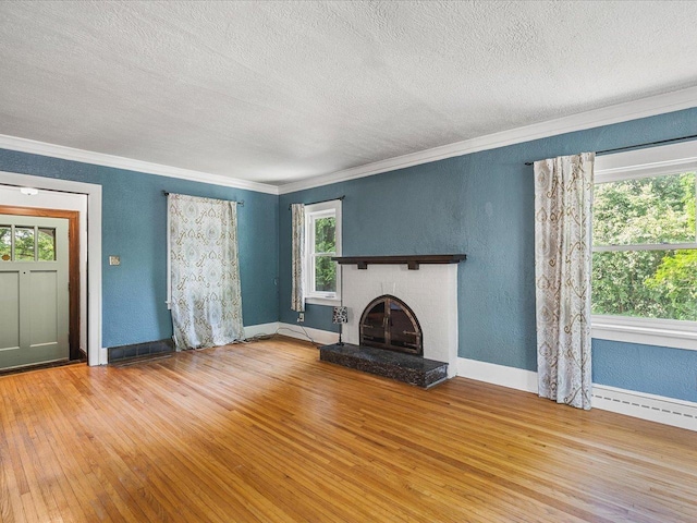 1639 Arlington Ave, Rockford, IL 61107 - unfurnished living room with hardwood / wood-style floors, a textured ceiling, crown molding, a fireplace, and a textured wall
