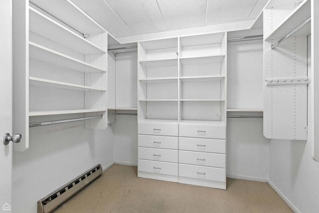1121 S Plymouth Ct Unit A, Chicago, IL 60605 - walk in closet featuring a baseboard radiator and light carpet