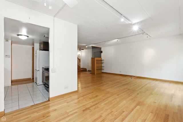 1121 S Plymouth Ct Unit A, Chicago, IL 60605 - unfurnished room featuring track lighting, light wood-type flooring, and a ceiling fan