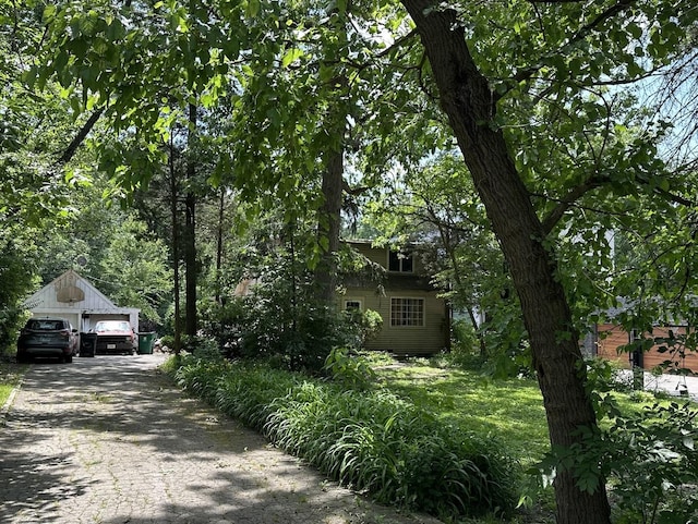 11407 Hiawatha Ln, Indian Head Park, IL 60525 - view of front facade with a detached garage and an outdoor structure