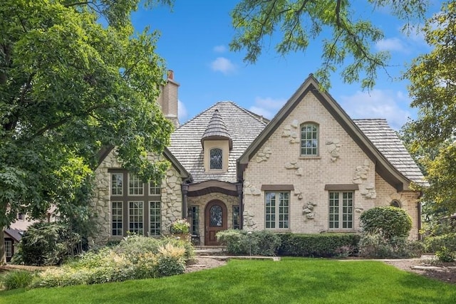 31 Oak St S, Hinsdale, IL 60521 - view of front of property with a chimney, a front lawn, and stone siding
