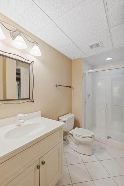 31 Oak St S, Hinsdale, IL 60521 - bathroom with a shower stall, vanity, tile patterned flooring, and a paneled ceiling