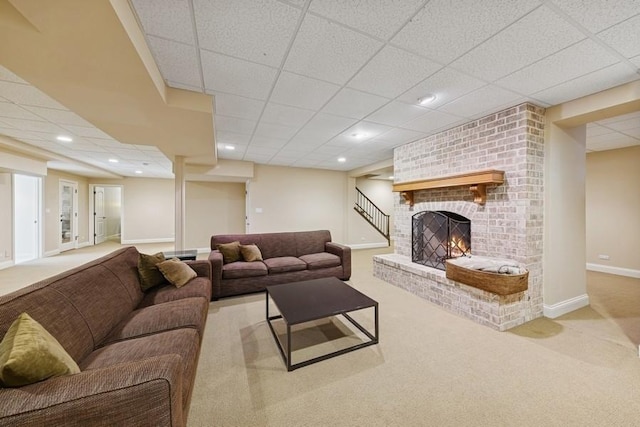 31 Oak St S, Hinsdale, IL 60521 - carpeted living room featuring a brick fireplace, recessed lighting, a drop ceiling, and stairway