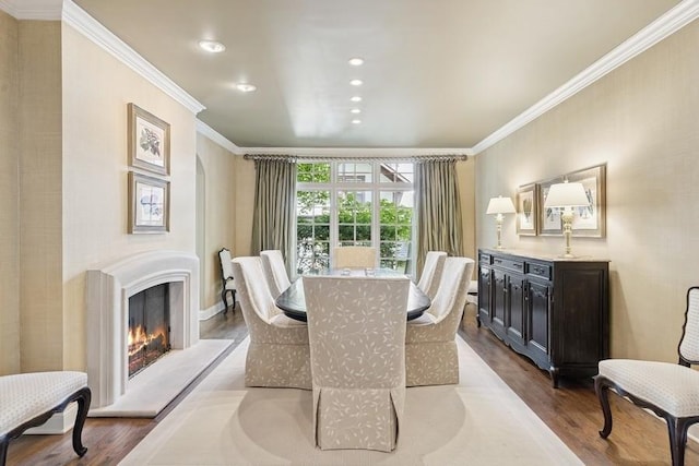 31 Oak St S, Hinsdale, IL 60521 - dining room featuring crown molding, dark wood-style flooring, a warm lit fireplace, and recessed lighting