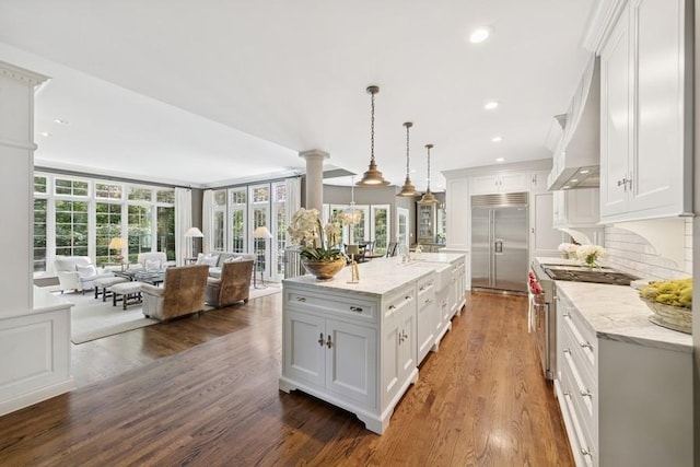 31 Oak St S, Hinsdale, IL 60521 - kitchen with high end appliances, open floor plan, white cabinetry, dark wood-style flooring, and recessed lighting