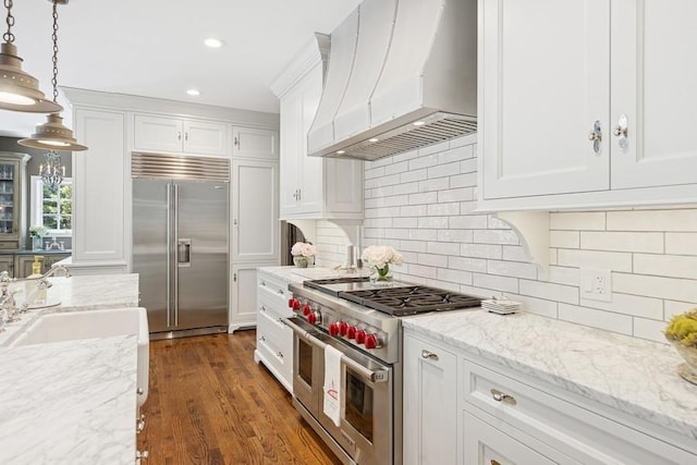 31 Oak St S, Hinsdale, IL 60521 - kitchen with high end appliances, custom range hood, white cabinetry, and recessed lighting