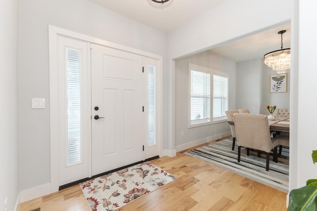 207 Eldon Dr, Downs, IL 61736 - foyer entrance with a chandelier and light wood-type flooring