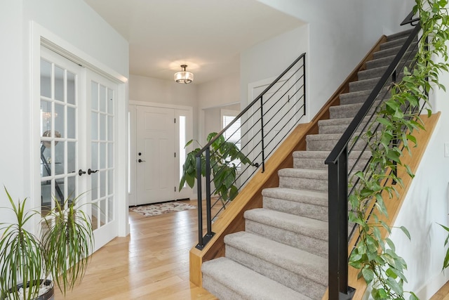 207 Eldon Dr, Downs, IL 61736 - foyer entrance with stairway and light wood-style floors