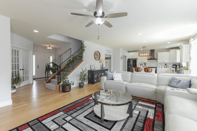 207 Eldon Dr, Downs, IL 61736 - living room featuring recessed lighting, stairway, ceiling fan, and light wood finished floors