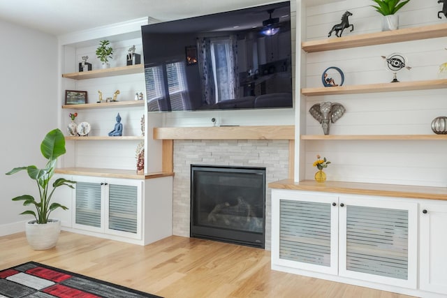 207 Eldon Dr, Downs, IL 61736 - living room with wood finished floors and a glass covered fireplace