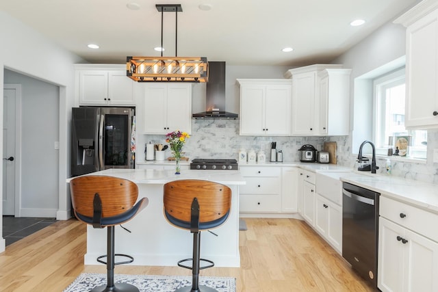 207 Eldon Dr, Downs, IL 61736 - kitchen with wall chimney exhaust hood, dishwasher, stainless steel fridge with ice dispenser, light wood-type flooring, and a kitchen bar