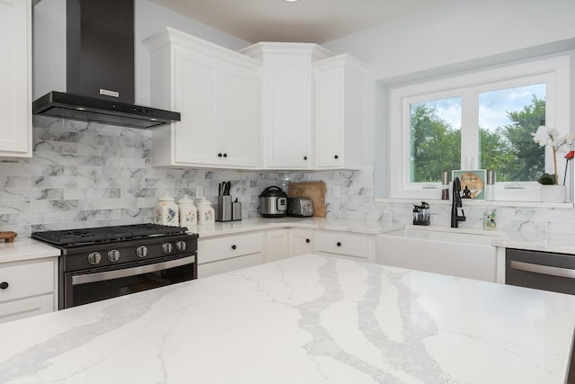 207 Eldon Dr, Downs, IL 61736 - kitchen featuring wall chimney exhaust hood, black range with gas stovetop, dishwasher, and white cabinetry
