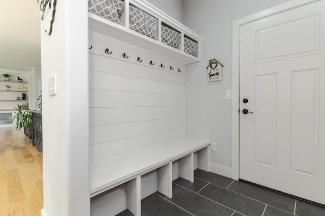 207 Eldon Dr, Downs, IL 61736 - mudroom featuring baseboards and dark tile patterned flooring