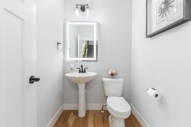 207 Eldon Dr, Downs, IL 61736 - half bathroom with wood finished floors and toilet