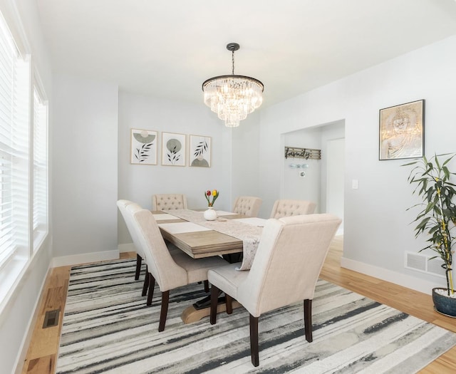 207 Eldon Dr, Downs, IL 61736 - dining space with a chandelier and wood finished floors