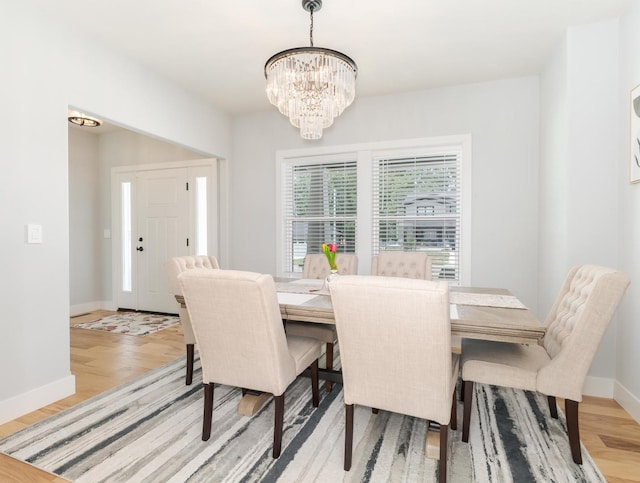 207 Eldon Dr, Downs, IL 61736 - dining area featuring a chandelier and light wood finished floors