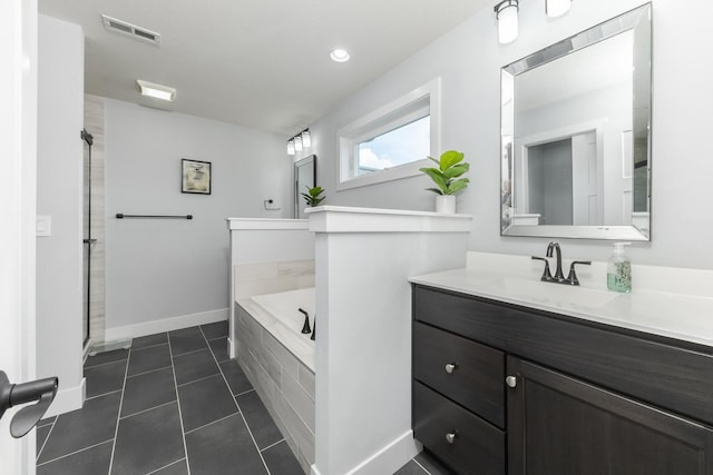 207 Eldon Dr, Downs, IL 61736 - bathroom with a garden tub, vanity, tile patterned floors, a shower, and recessed lighting