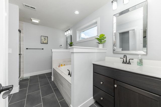207 Eldon Dr, Downs, IL 61736 - full bathroom featuring a bath, vanity, tile patterned flooring, and a shower