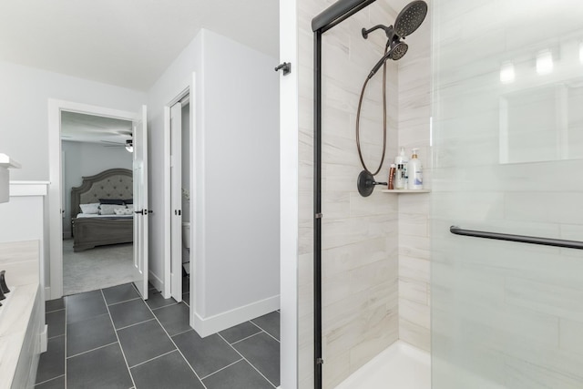 207 Eldon Dr, Downs, IL 61736 - ensuite bathroom with a stall shower, a ceiling fan, and tile patterned floors