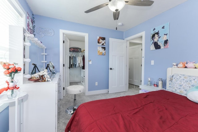 207 Eldon Dr, Downs, IL 61736 - bedroom with light colored carpet, ceiling fan, and a spacious closet