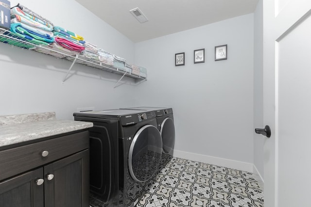 207 Eldon Dr, Downs, IL 61736 - laundry room featuring separate washer and dryer and cabinet space