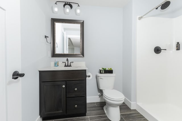 207 Eldon Dr, Downs, IL 61736 - full bathroom with vanity, a shower, and wood finished floors