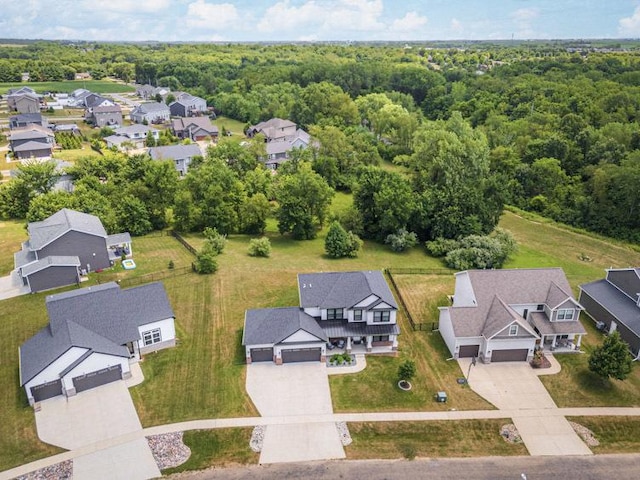 207 Eldon Dr, Downs, IL 61736 - aerial perspective of suburban area with a heavily wooded area