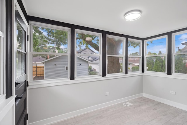 5406 N Mulligan Ave, Chicago, IL 60630 - unfurnished sunroom featuring healthy amount of natural light