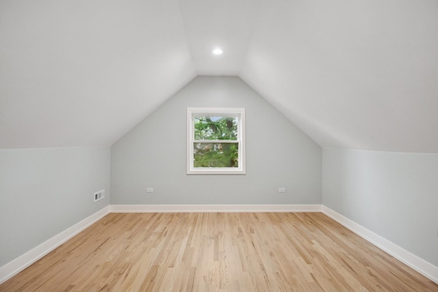 5406 N Mulligan Ave, Chicago, IL 60630 - additional living space with vaulted ceiling and light wood-type flooring