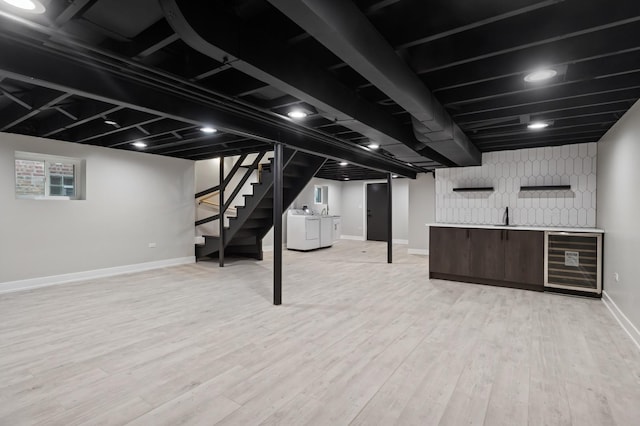 5406 N Mulligan Ave, Chicago, IL 60630 - basement featuring washer and dryer, wet bar, beverage cooler, stairway, and light wood-type flooring