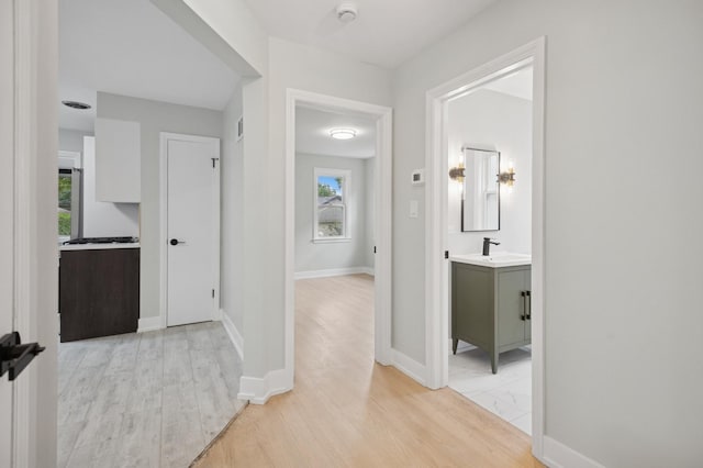 5406 N Mulligan Ave, Chicago, IL 60630 - hallway with healthy amount of natural light and light wood-style flooring