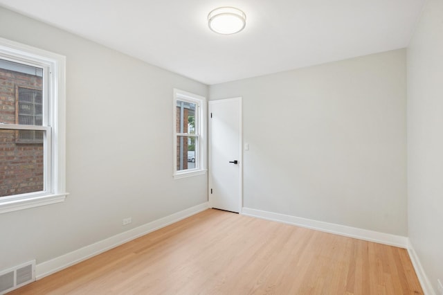 5406 N Mulligan Ave, Chicago, IL 60630 - spare room featuring light wood-style flooring and baseboards