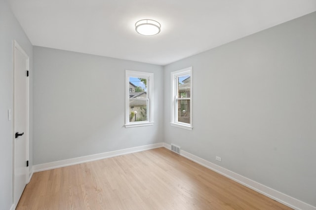 5406 N Mulligan Ave, Chicago, IL 60630 - empty room with light wood finished floors and baseboards