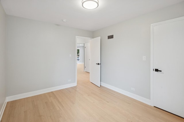5406 N Mulligan Ave, Chicago, IL 60630 - unfurnished bedroom with light wood finished floors and baseboards