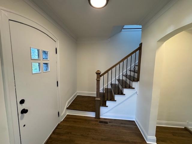 3512 Woodside Ave, Brookfield, IL 60513 - entryway with crown molding, wood finished floors, arched walkways, and stairway