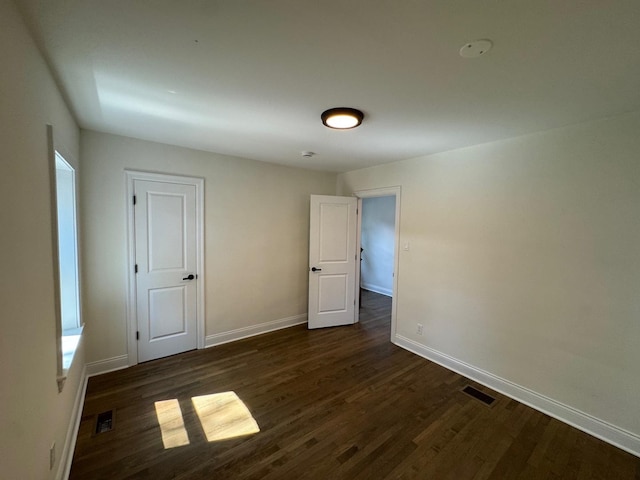 3512 Woodside Ave, Brookfield, IL 60513 - unfurnished bedroom featuring dark wood finished floors and baseboards