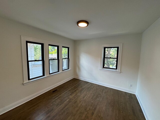 3512 Woodside Ave, Brookfield, IL 60513 - spare room with dark wood-style floors and plenty of natural light