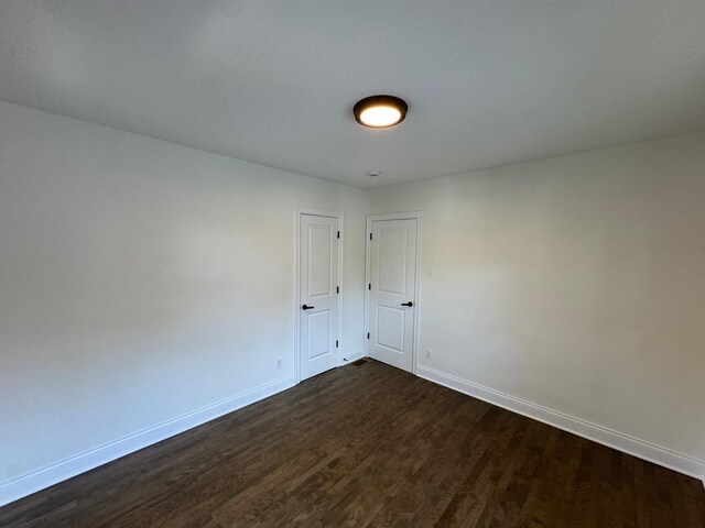 3512 Woodside Ave, Brookfield, IL 60513 - empty room featuring baseboards and dark wood-style floors
