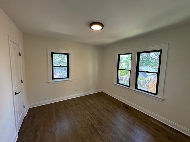 3512 Woodside Ave, Brookfield, IL 60513 - unfurnished room featuring dark wood-style flooring and healthy amount of natural light