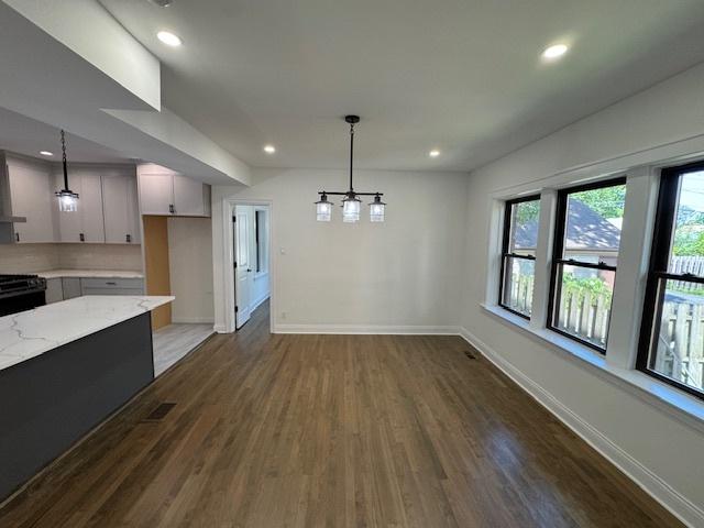 3512 Woodside Ave, Brookfield, IL 60513 - unfurnished dining area featuring dark wood-style flooring, recessed lighting, and a chandelier