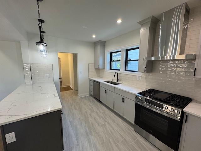 3512 Woodside Ave, Brookfield, IL 60513 - kitchen with appliances with stainless steel finishes, wall chimney exhaust hood, tasteful backsplash, light stone counters, and gray cabinetry