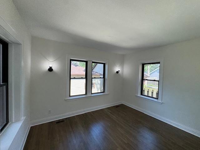 3512 Woodside Ave, Brookfield, IL 60513 - spare room featuring dark wood-style floors and baseboards